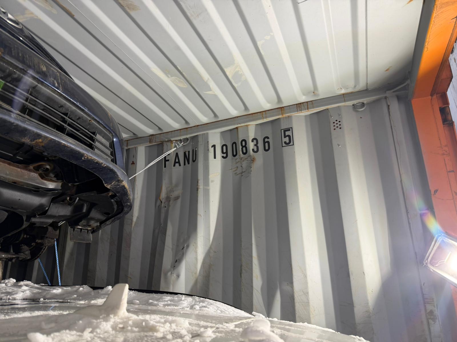 Vehicle secured inside the shipping container