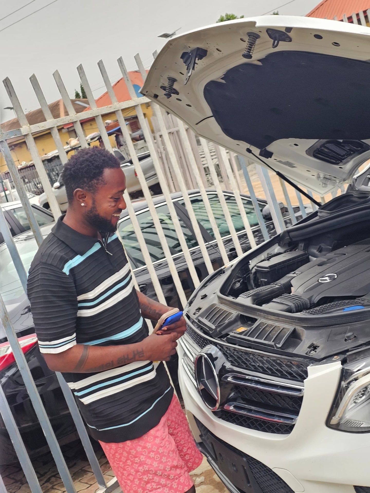 Customer inspecting the delivered vehicle in Nigeria
